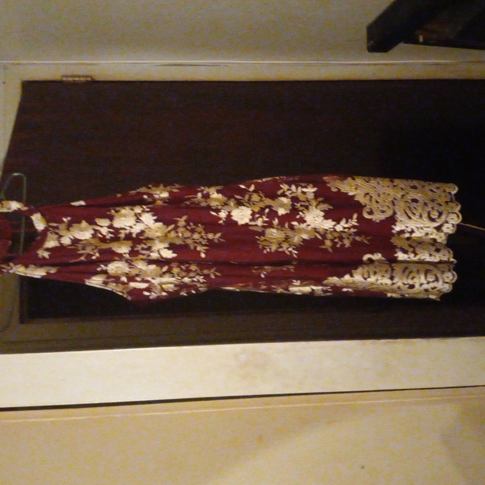 Burgundy dress with a sheer overlay with cream flowers an embroidery
